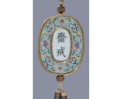 A Chinese Famille-Rose porcelain 'Floral' Abstinence plaque, Qing Dynasty, Qianlong Period, of oval form, one side centred wi