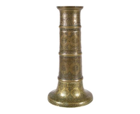 A Safavid brass candlestick, Persia, 17th century and later, of faceted columnar form, the flared base a later replacement, d