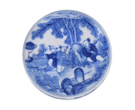 A Chinese blue and white seal paste box and cover, Qing Dynasty, probably depicting a seated sage having medicines prepared f