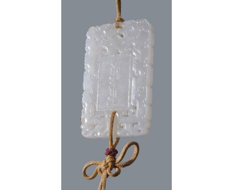 A Chinese white jade 'abstinence' plaque, the pendant is carved and pierced on each side with two stylised confronting dragon