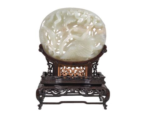 A Chinese white or pale celadon jade Yuan-style oval 'lotus and goose' plaque, carved in openwork with a goose skimming the s