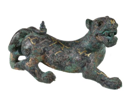 A Chinese archaistic model of a mythical tiger, the vigorously  modelled striding beast with mouth open showing teeth and hea