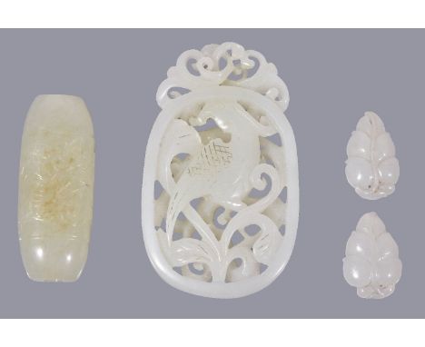 A Chinese white jade openwork pendant, carved with a bird amongst scrolling foliage, incised details, 6.1cm high x 4.2cm wide