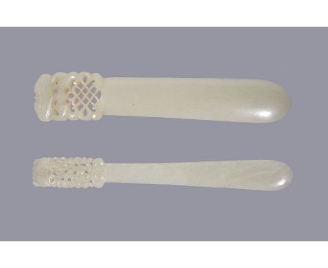 Two Chinese pale celadon jade hair pins, Qing Dynasty, 19th century, with openwork details one with a bat and scrolls and the