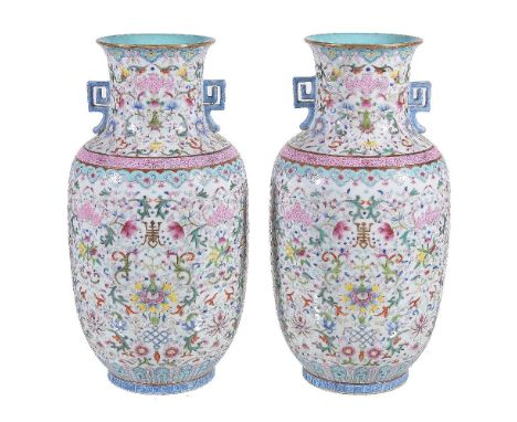 A pair of Chinese Famille Rose two-handled vases, enamelled in shades of rose-pink, blue, green, yellow and red and reserved 