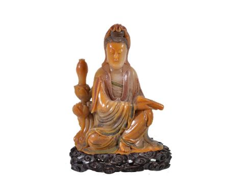 A Chinese Shoushan soapstone figure of Guanyin, Qing Dynasty, 19th century, the well carved figure seated in lalitasana and h