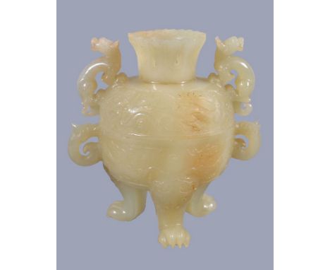 A Chinese pale celadon jade bowl and cover, with some brown inclusions, supported on three lion paw feet, the ovoid body with