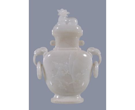 A Chinese white hardstone vase and cover, probably circa 1900-1930, the flattened ovoid body carve with rocks, flowers and br