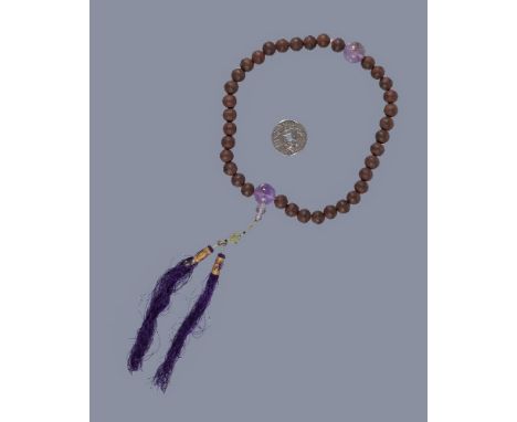 A string of Chinese wood beads, Shouchan, consisting of 36 wood beads, the wood with strong smell and possibly aloeswood, wit