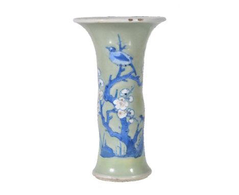 A Chinese small blue and white celadon-ground 'phoenix-tail' vase, gu, Kangxi, moulded in relief with flowering prunus trees 