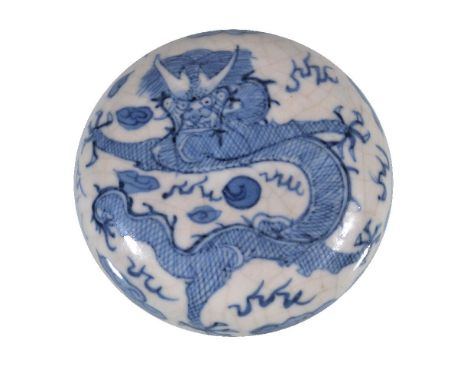 A Chinese blue and white circular seal box and cover, Qing Dynasty, 19th century, painted with a dragon chasing a flaming pea