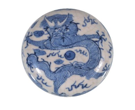 A Chinese blue and white circular seal box and cover, Qing Dynasty, 19th century, painted with a dragon chasing a flaming pea