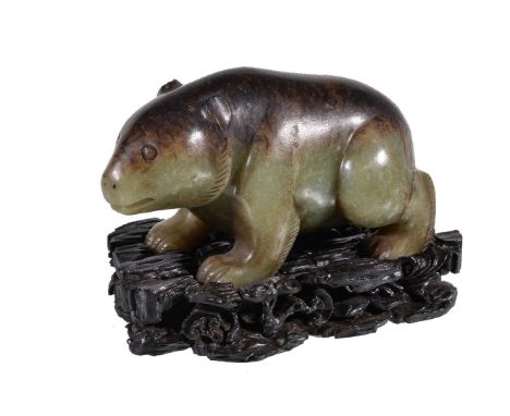 A Chinese celadon and brown jade bear, with incised details, the natural brown marking to the stones used to form the head an