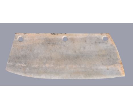 A large Chinese archaistic ceremonial jade or stone blade, with a long upper edge along its length and two sides spread outwa