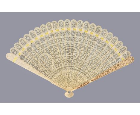 Y A Chinese ivory brise fan, Canton, first quarter of the 19th century, carved on one side, with an oval central reserve flan