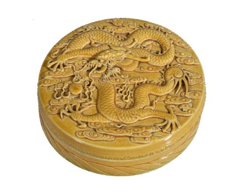 A rare Chinese porcelain yellow-glazed circular ink stone box and cover, Guangxu, the cover well modelled with a dragon chasi