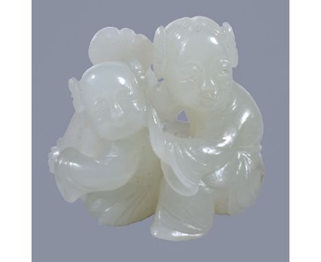 A small white jade group of a mother and child, both seated with the child holding a ruyi sceptre, 3.3cm high x 3.5cm wide x 