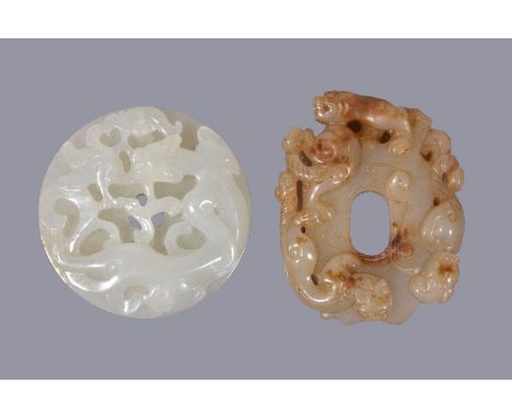 A Chinese white jade 'chilong' disc, bi, carved to the top with a chilong and the underside with archaic type scrolls, with s