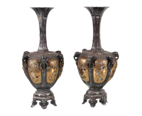 A pair of silver and lacquer vases, the body of each of a loved, ovoid form mounted with elephant-head and ring handles to th