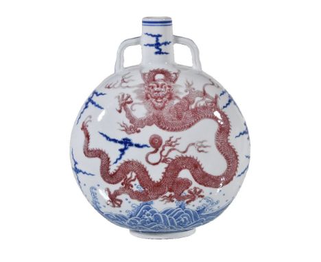 An Imperial-style Chinese blue and copper-red glazed 'dragon' moonflask, bianhu, the rounded flattened body vividly painted i