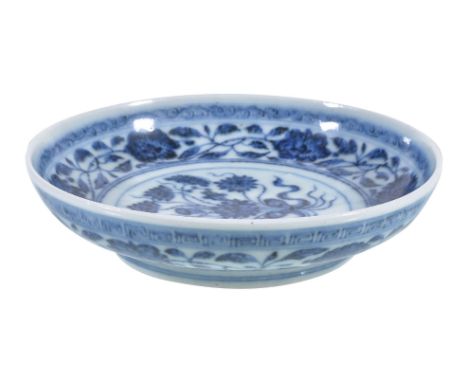 A attractive small Chinese blue and white 'Lotus Bouquet' dish, painted to the interior with a central medallion enclosing a 