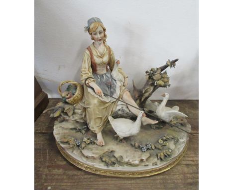 A Capodimonte porcelain model, of a girl seated with geese, height 9.5ins
