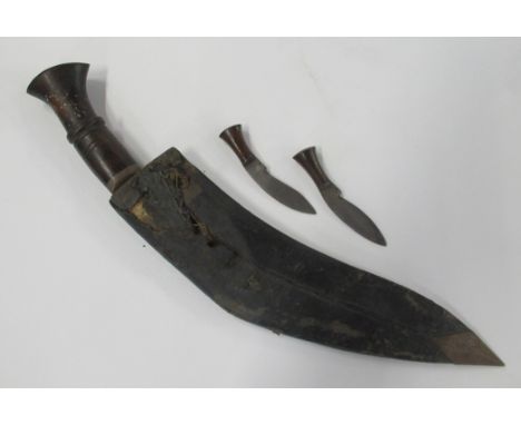 An antique kukri knife, with leather covered scabbard