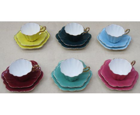 SET OF SIX ROYAL STUART HARLEQUIN GILDED CERAMIC TRIOS BY SPENCER STEVENSON