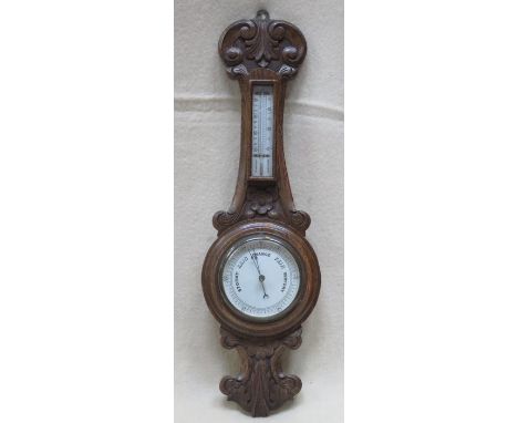 CARVED OAK CASED ANEROID BAROMETER 