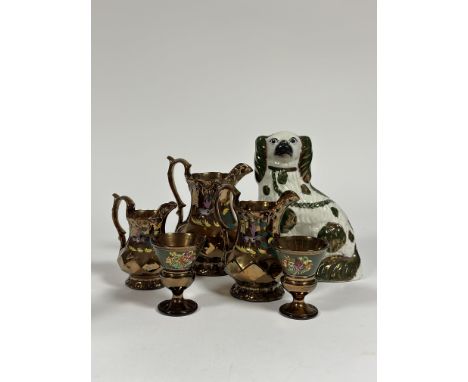 A group of lustreware comprising a pair of wine glasses (h -10cm) decorated with a band of green enameling and a display of f