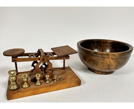 An Edwardian estate made set of postal balance scales complete with six matching weights, (h 14cm, base 27cm x 13.5cm) and an