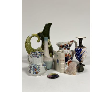 A group comprising of a Bretby Art Nouveau decorative jug decorated with green enameling and floral display to the front. (h 