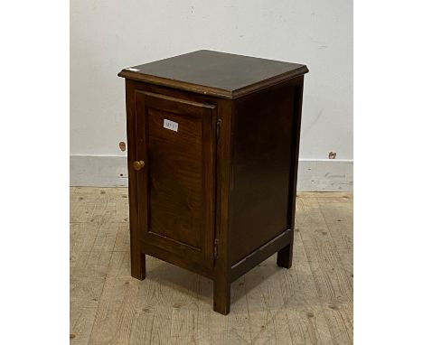 A stained walnut bedside table, the panelled door opening to a shelf H70cm W42cm, D40cm