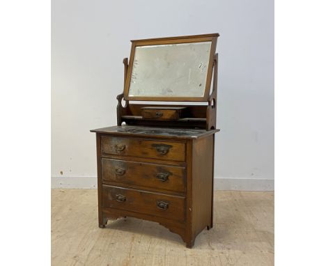 An early 20th cenrury walnut dressing chest, fitted with swing mirror over three drawers, bracket supports, H155cm, W91cm, D4
