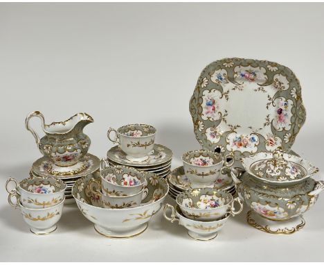 A 19th century Derby part tea service decorated with gold gilding and silver and floral enameling, comprising two serving pla
