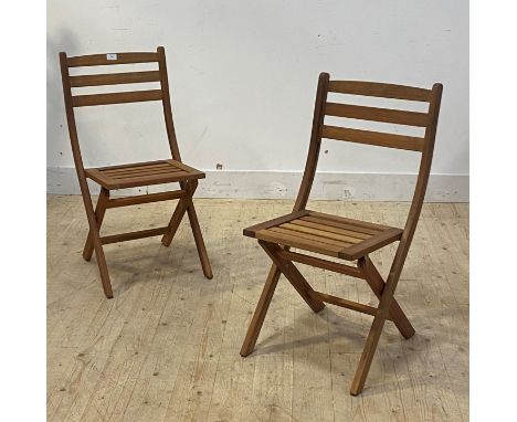 A pair of slatted teak folding garden chairs, H82cm
