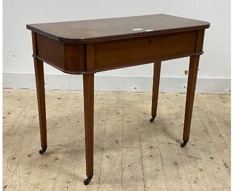 An Edwardian mahogany console table, the top lifting to reveal baize lined cutlery case, raised on square tapered supports wi