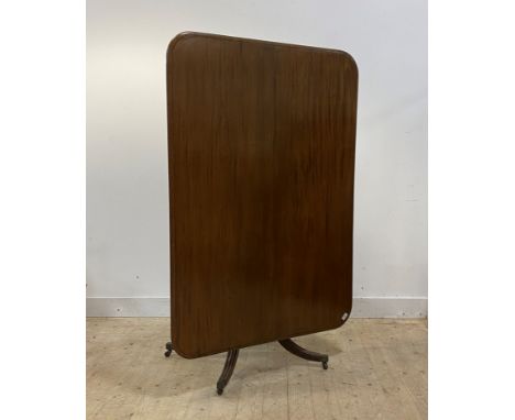 A George III mahogany tilt top breakfast table, the moulded top over ring turned column raised on four reeded splayed support