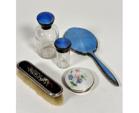 A white metal enamelled dressing table hand mirror with pale blue guilloche enamelled decoration, a/f, a blue guilloche ename