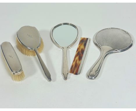 A London silver Mappin &amp; Webb engine turned decorated four piece dressing table brush set including hair brush, (L: 25cm)