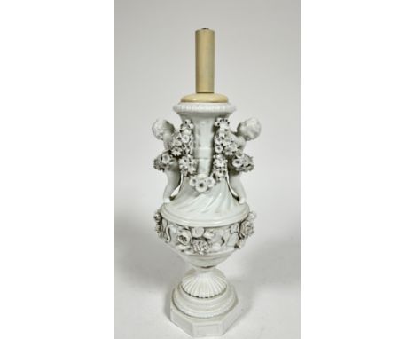 A Meissen blanc de chine porcelain baluster vase lamp, the moulded top with twin putti figures holding garlands of flowers ab