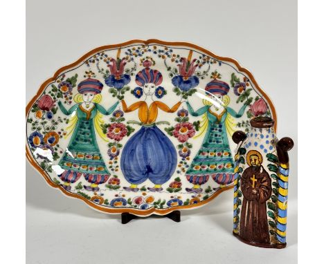 A Greek Skyros scalloped dish decorated with Middle Eastern style dancing figures, decorated with polychrome enamels, (4cm x 