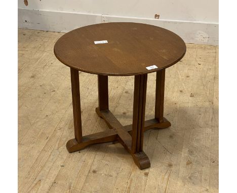 A 1930's oak circular lamp table on cruciform base, H43cm, D51cm