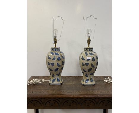 A pair of Chinese style crackle glazed blue and white ceramic table lamps, H44cm (excluding bulb)