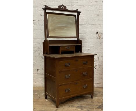 An Art Nouveau period walnut dressing chest, with swing mirror over trinket drawer and three long drawers, turned supports, H