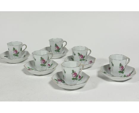 A set of six Hungarian Herend pottery octagonal chocolate cups and saucers decorated with pink rose sprays, (h 6.5cm x 5.5cm)