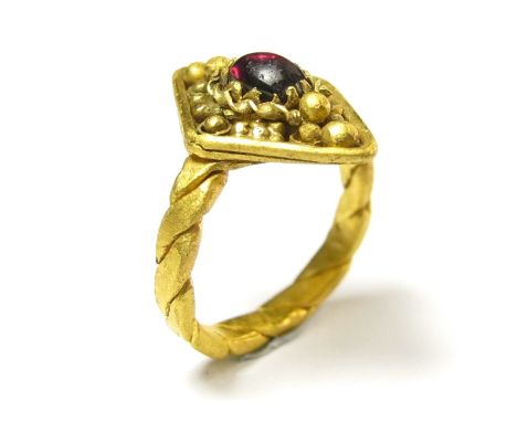 Carolingian Gold Ring.Circa 9th century AD. Gold, 6.72 grams. 21.56 mm, internal 15.74 mm. A large lozenge-shaped bezel decor