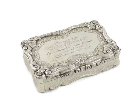 A Victorian silver presentation snuff box, by David Pettifer, Birmingham 1854,rectangular form, modelled scroll border with e