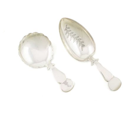 Two George III silver caddy spoons, by Thomas James, London 1810 and 1813, one with a wavy-edge circular bowl, and one with a
