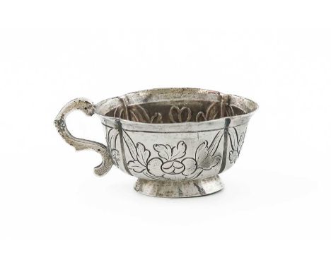 An 18th century Russian silver vodka cup,Moscow 1782,oval lobed from, foliate decoration, scroll handle, length 7.2cm, approx